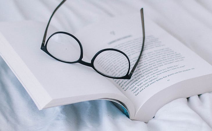 how reading in bed helps sleep - image of book in bed