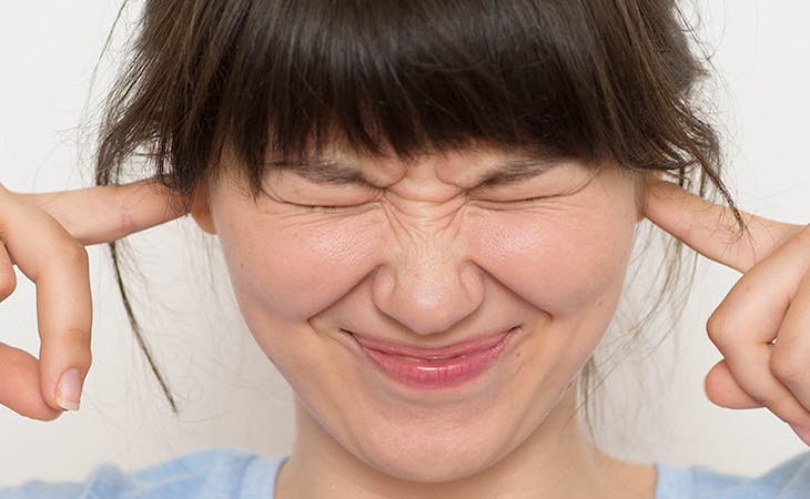 how to deal with snoring - image of woman with hands in ears