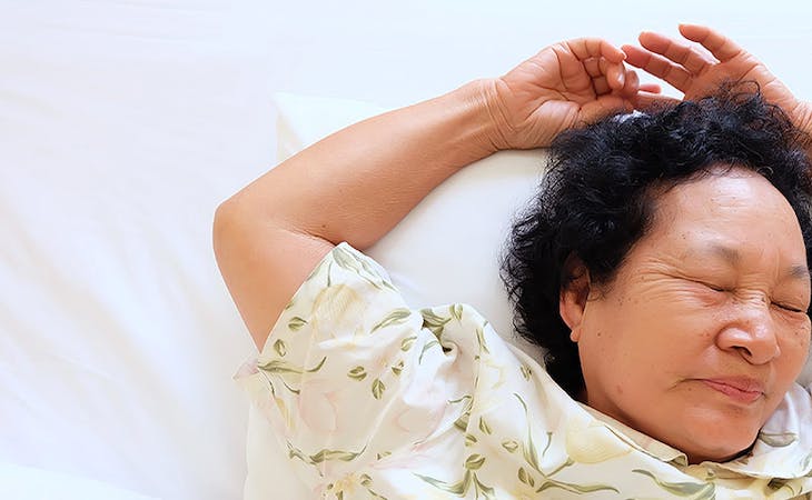 image of senior woman sleeping - sleep tips for older people