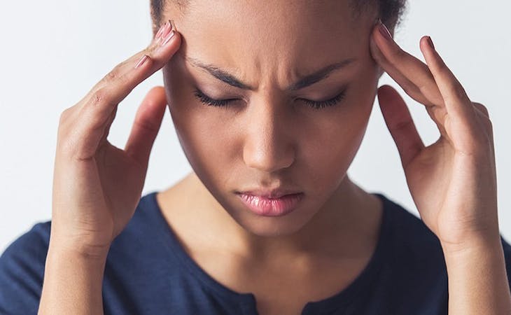 image of woman with exploding head syndrome sleep disorder