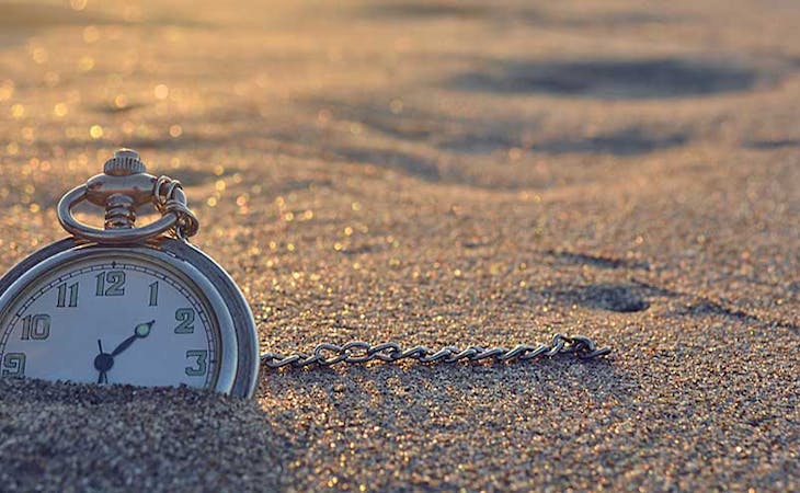 circadian rhythm - image of clock outside in sand