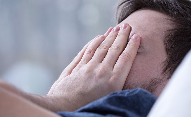 image of sleep-deprived man in bed