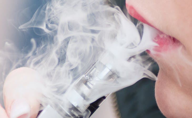 image of woman vaping nicotine