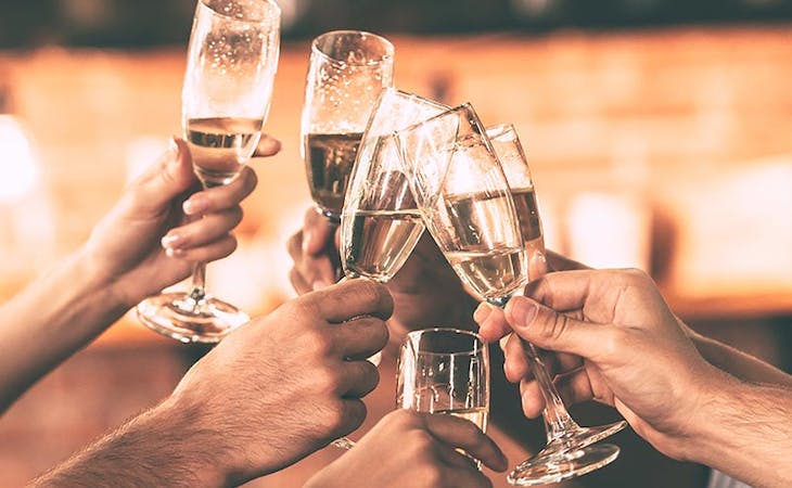 image of champagne toast - sleep tips for holidays