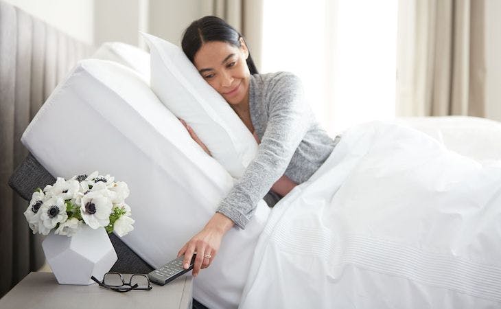 best mattress for health = person lying on adjustable base