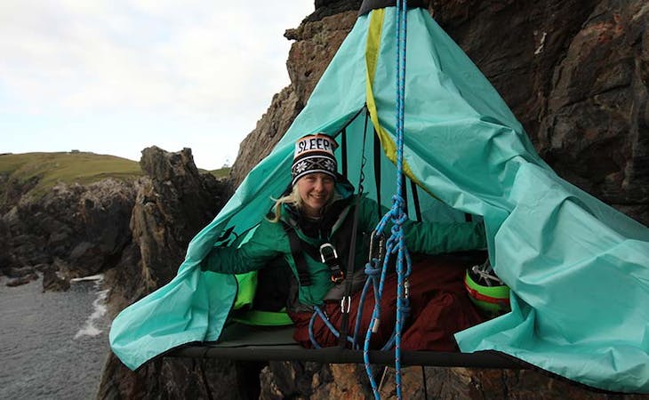 image of Phoebe Smith n her portaledge on a mission to raise money and awareness about youth homelessness through adventure