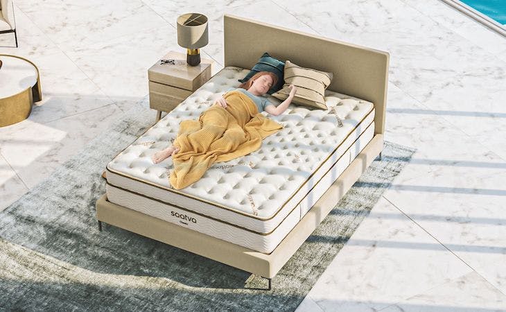 mattress myths - person lying on saatva mattress