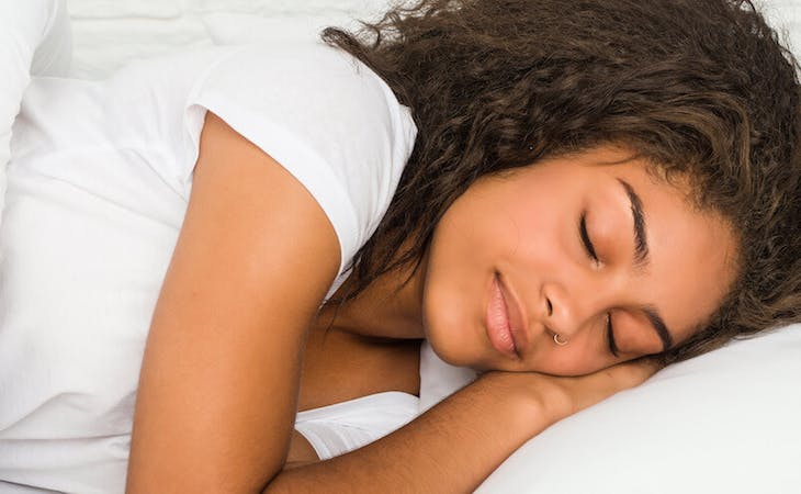 best combination sleeper pillow - image of person lying in bed