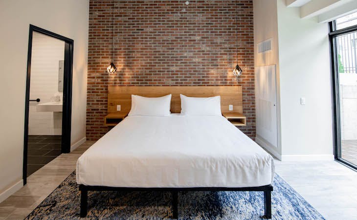 maj hotel bedroom featuring a saatva mattress