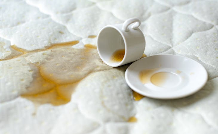 how to remove mattress stains - image of coffee spilled on mattress