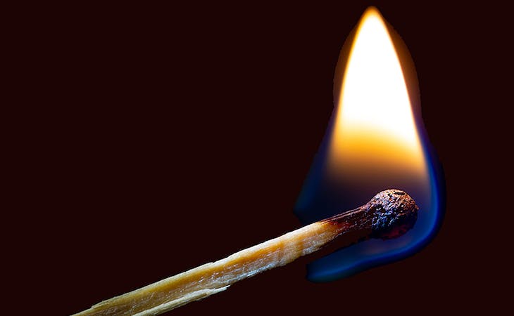 image of match lighting flame