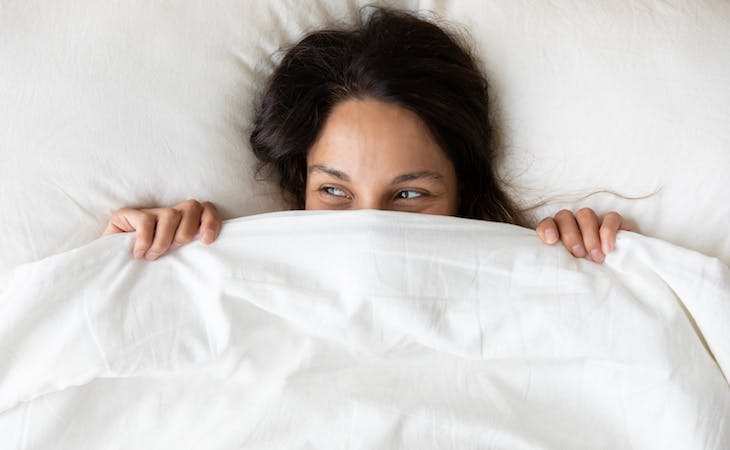 image of woman with sensitive skin under sheets