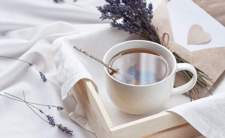 lavender and tea on top of bed