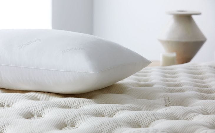 saatva down alternative pillow on top of bed