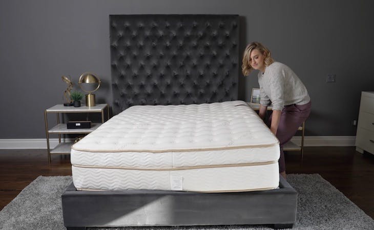 person rotating a mattress