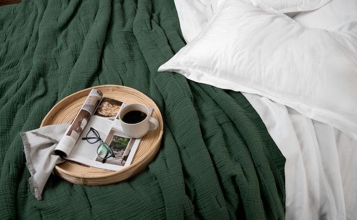 blanket on bed with tray on top