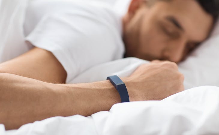 person monitoring sleeping heart rate with sleep tracker