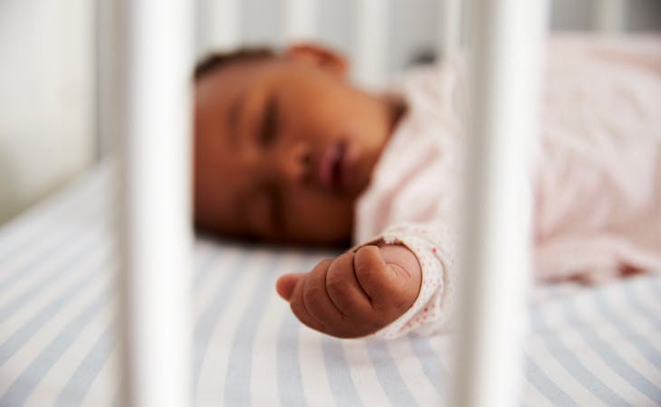 baby with rsv sleeping in crib