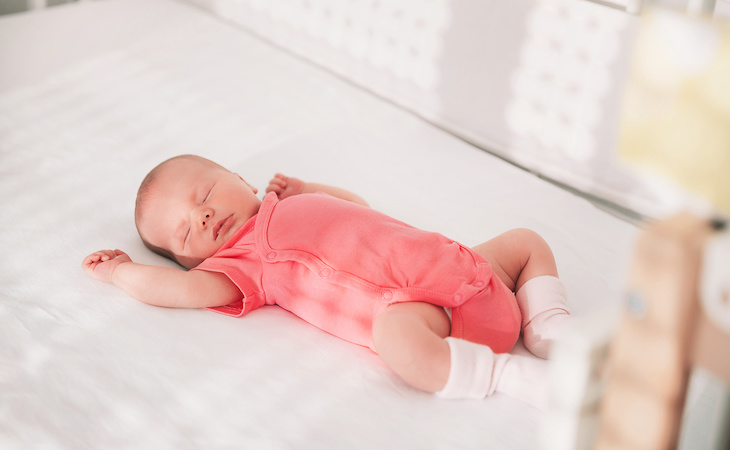 baby in a weighted sleep sack