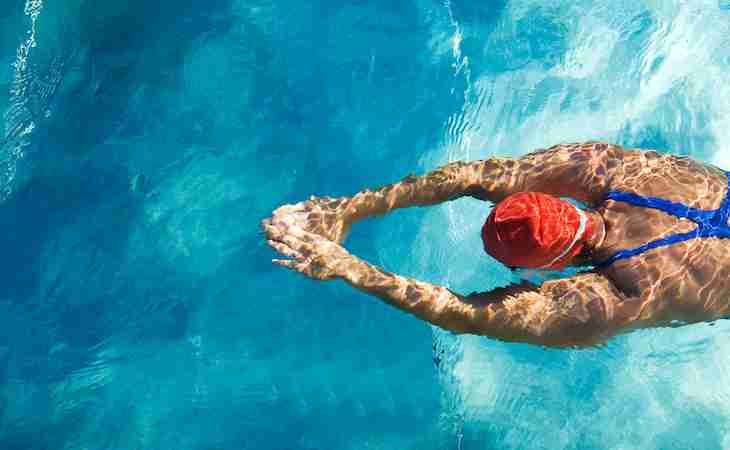 person swimming in pool