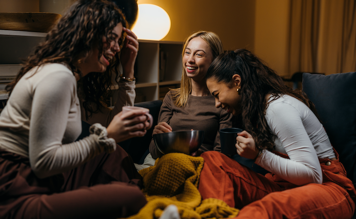 group of women having slumber party and laughing