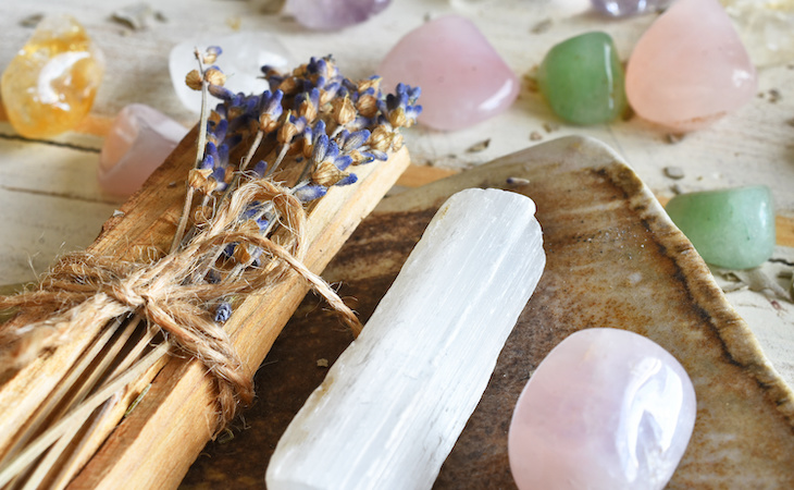 palo santo and crystals on a tray