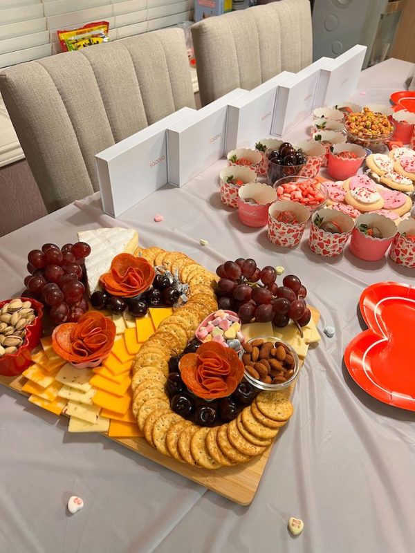 cheese board and snacks for galentine's day