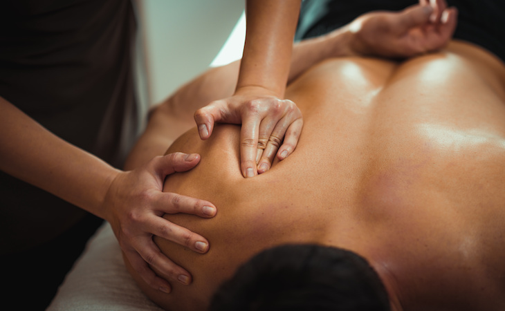 person getting a shoulder massage