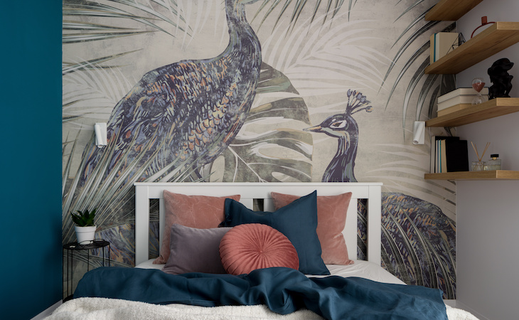 bedroom with stylish wallpaper featuring peacocks