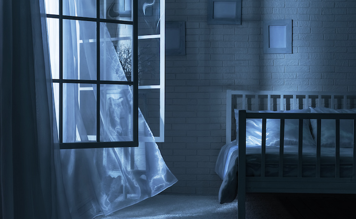 open window in bedroom at night