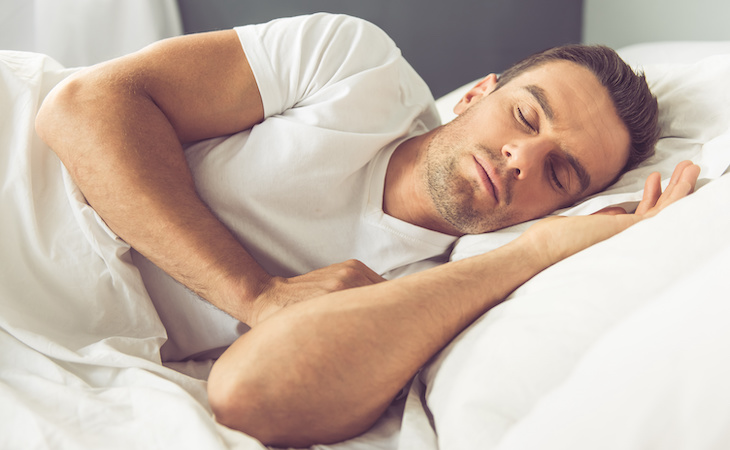 person lying on side in bed