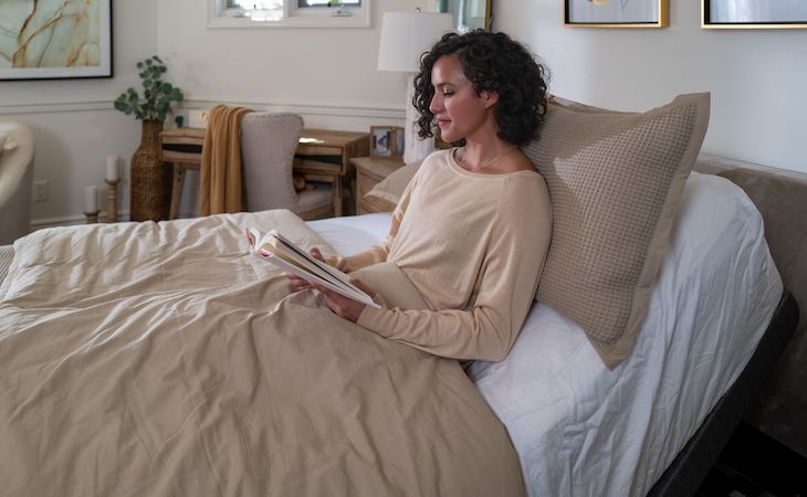 person lying in a zero gravity bed