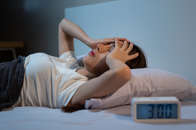 Woman in distress from waking up in the middle of the night