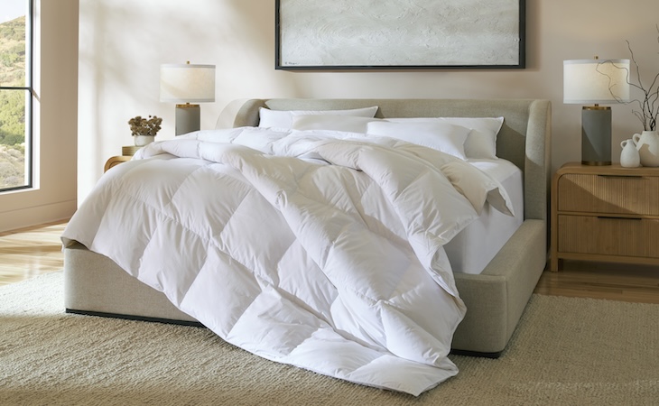 Cozy bed with white Saatva comforter
