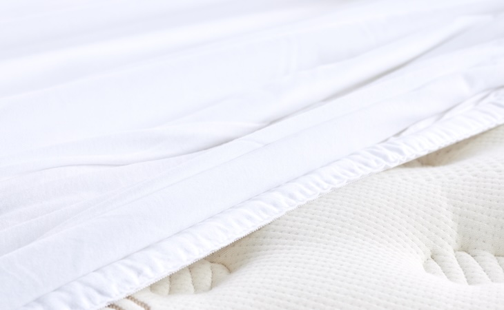 Saatva mattress protector on mattress