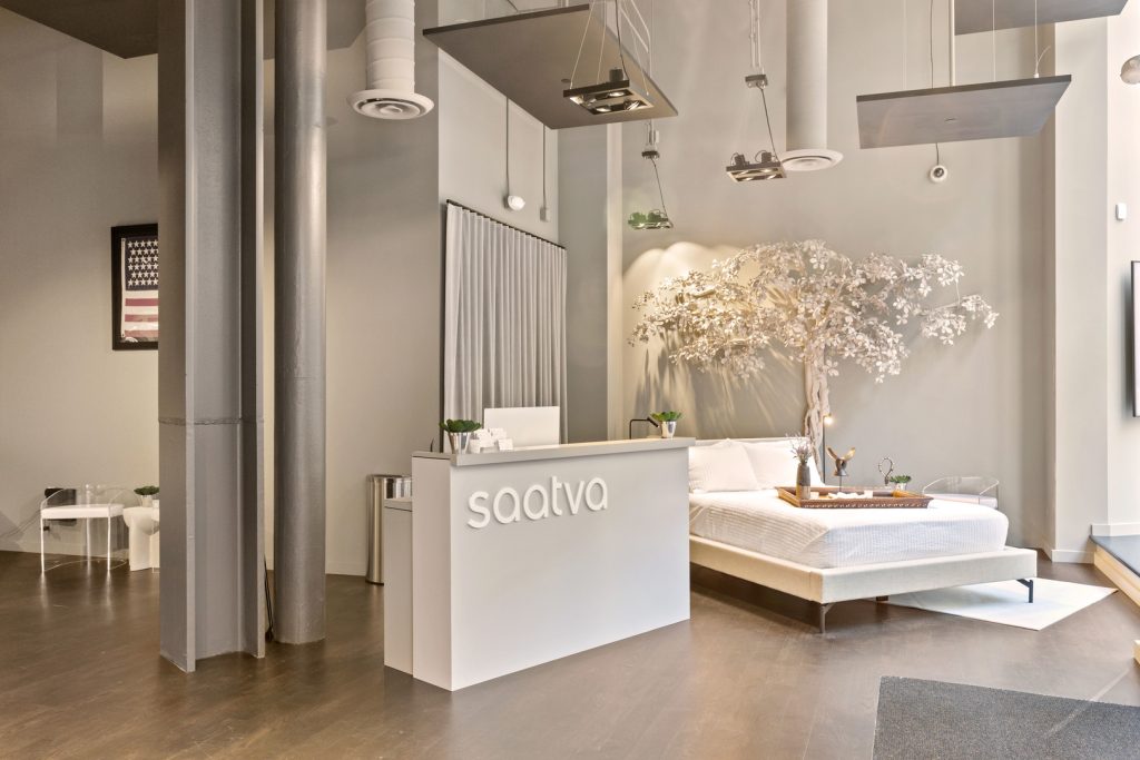 Saatva SF Interior with Tree and Check In Desk Closeup SlavaBlazerPhotography