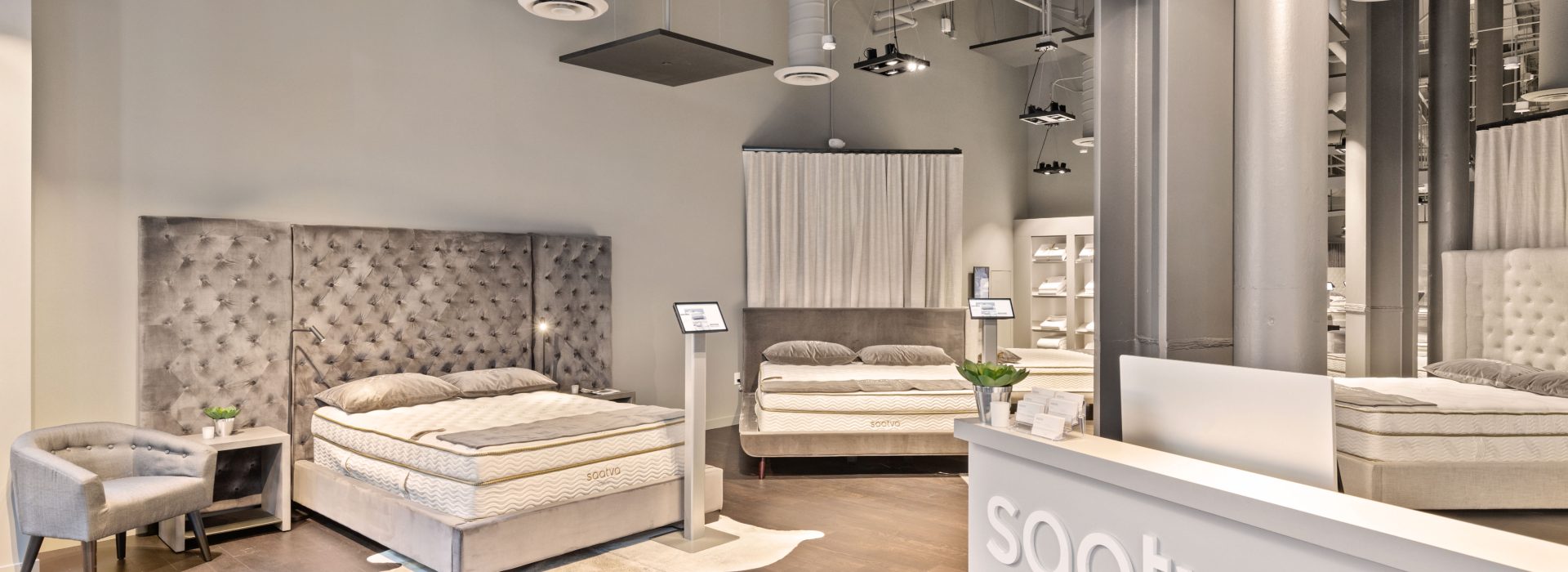 Saatva SF Interior with Tree and Check In Desk Right Side SlavaBlazerPhotography scaled