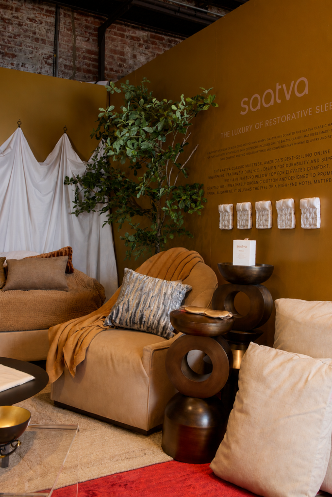 Saatva x Hines Collective for DOAD 20026 vignette featuring Saatva's Anais chair, Sweater Knit Blanket, Velvet Pick-stitch Quilt, Vara Rug Saatva Classic Mattress, Santorini Bedframe and Dog Beds.