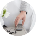 Remote in hand being used to adjust the Saatva Adjustable Base Plus