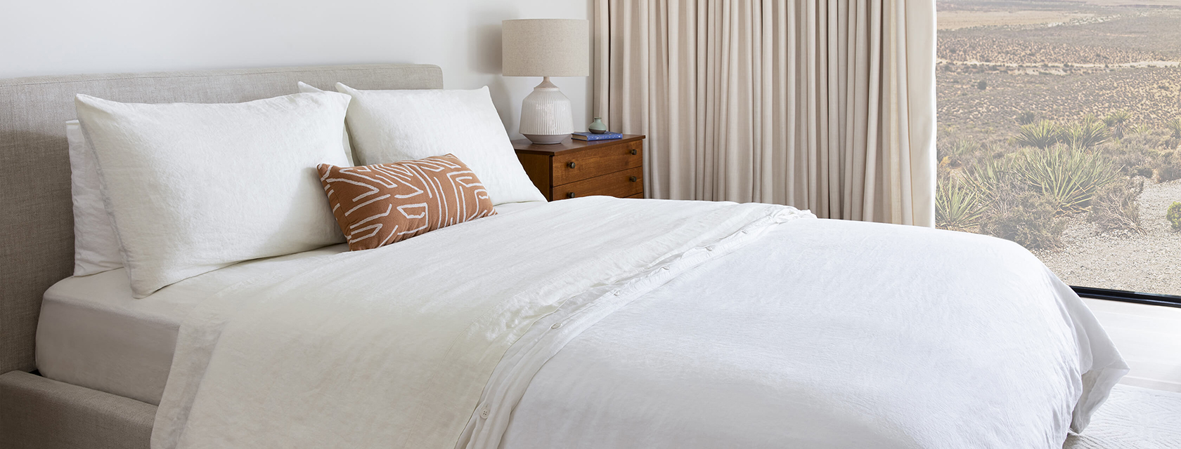 Bed with Saatva sheets.