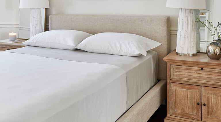 A made room with Saatva sheets.