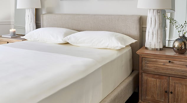 A made room with Saatva sheets.