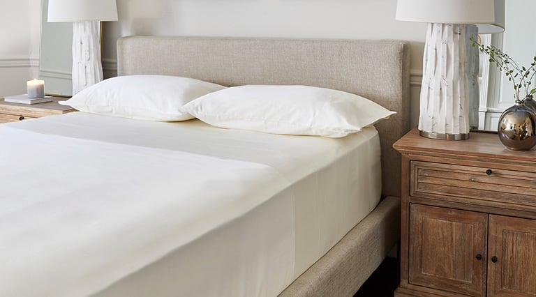 A made room with Saatva sheets.