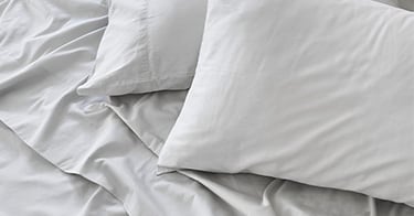Saatva sheets with matching pillowcases.