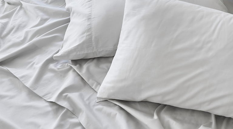 Saatva sheets with matching pillowcases.