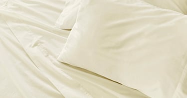 Saatva sheets with matching pillowcases.