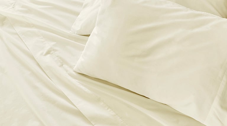Saatva sheets with matching pillowcases.